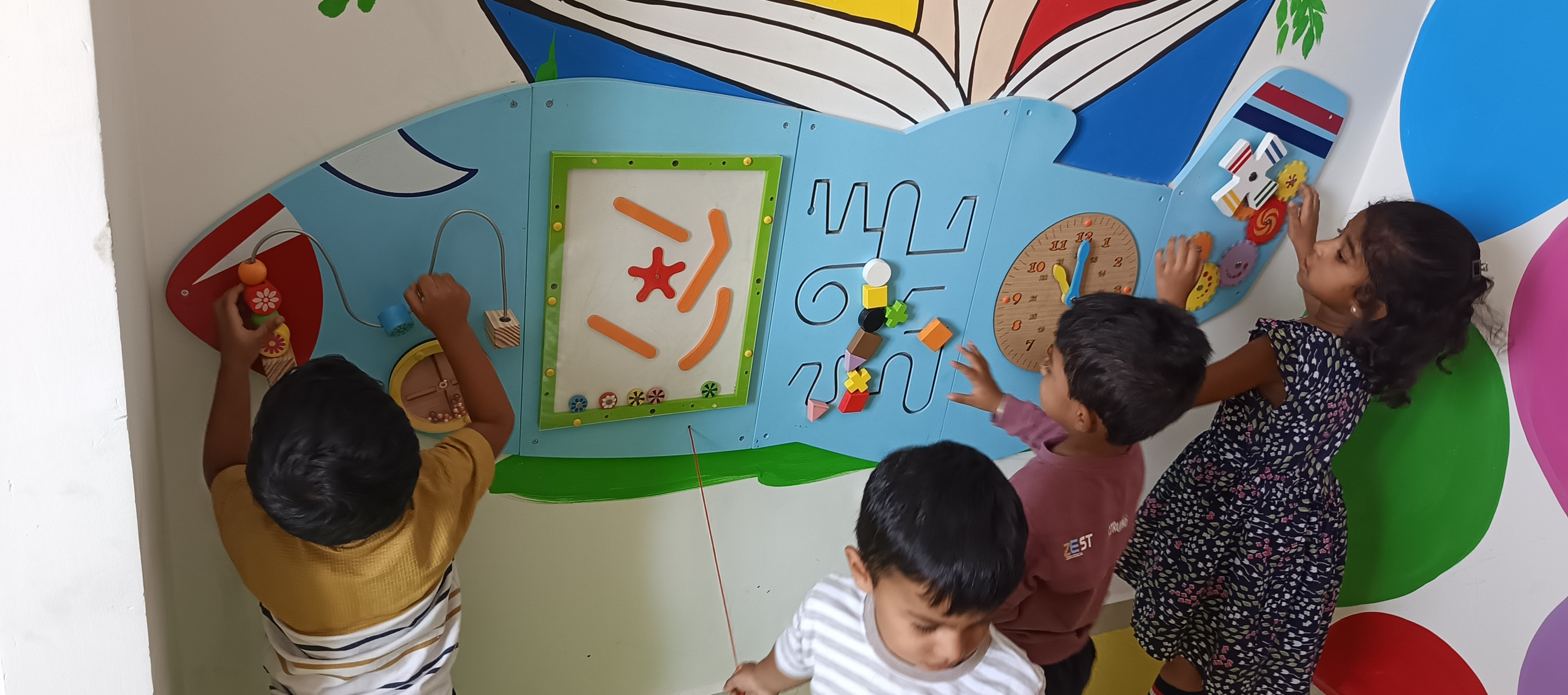 Students developing fine motor skills with play sand